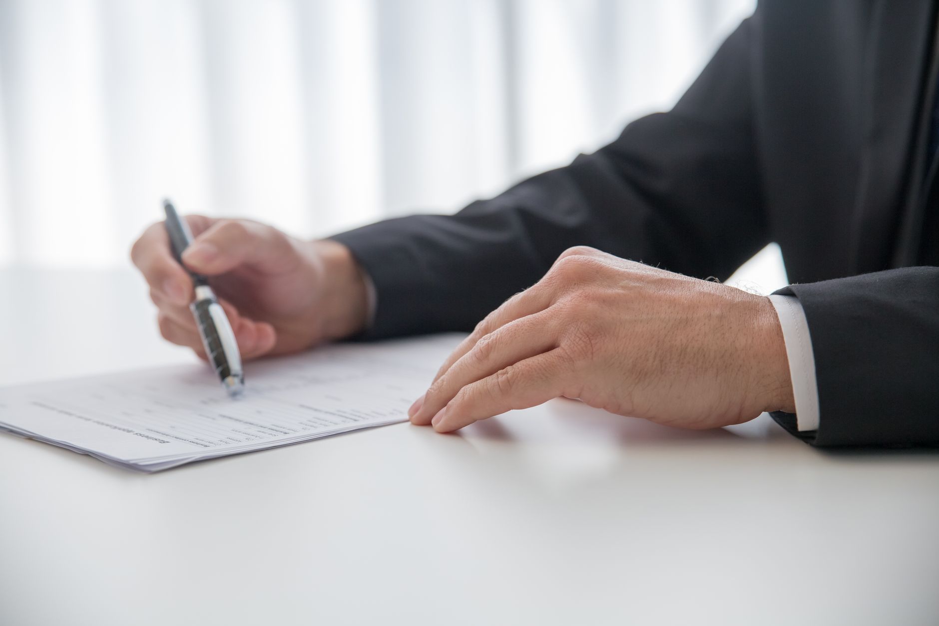 Close up on executive lawyers finalizing shareholder agreement documents