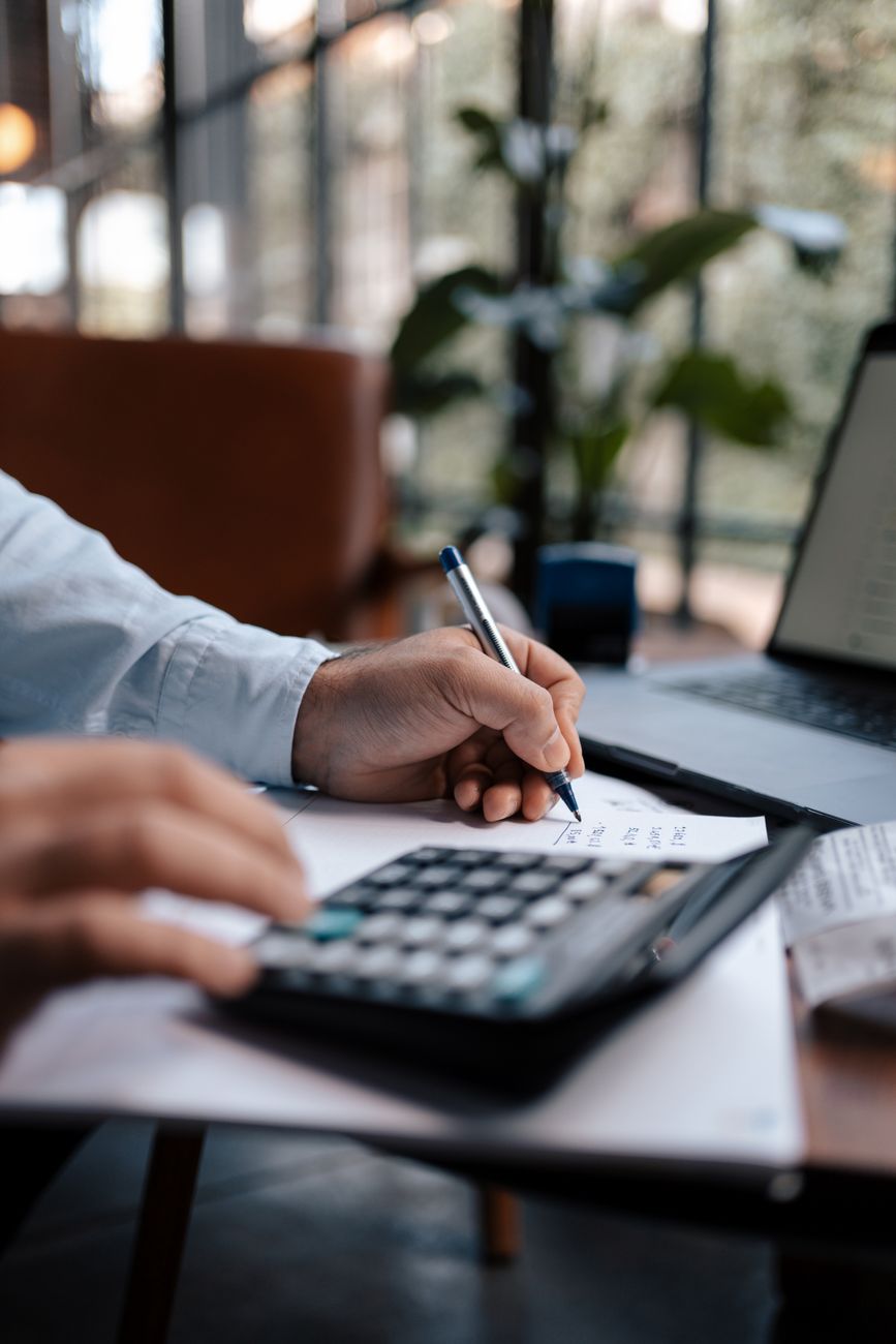 Business numbers on analytical sheet representing tax optimization